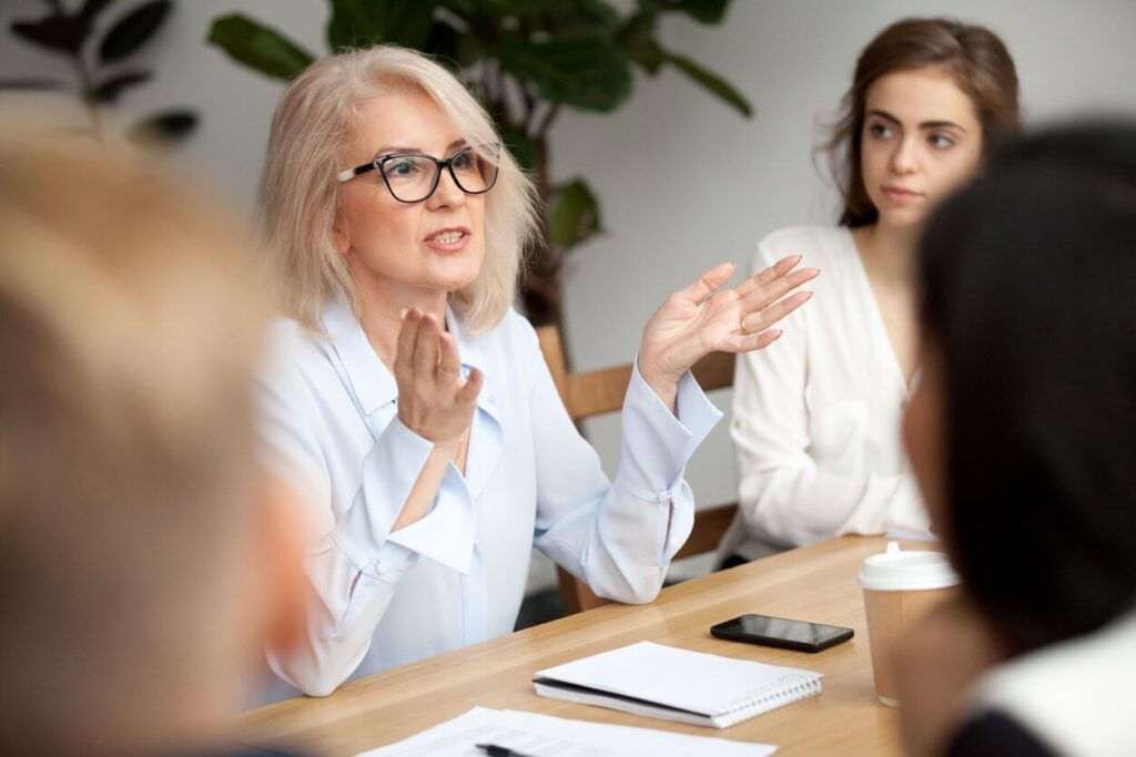 A woman speaking at a meeting