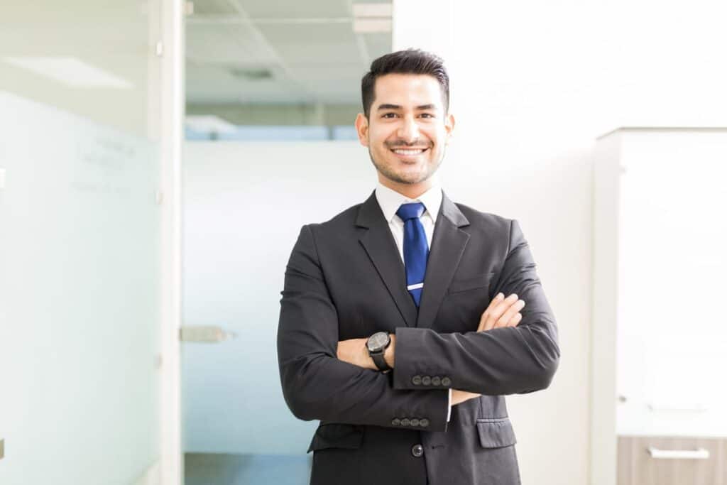 A car accident lawyer posing and smiling for a photo in Miami, FL.