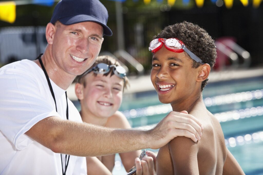 swim coach with child