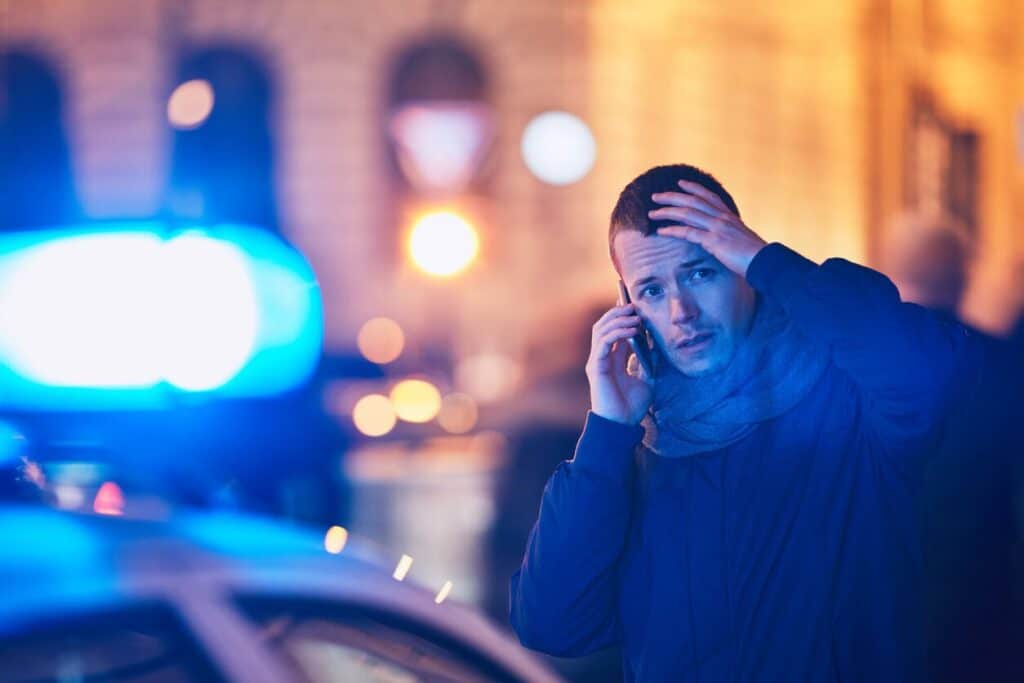 man on phone after car accident