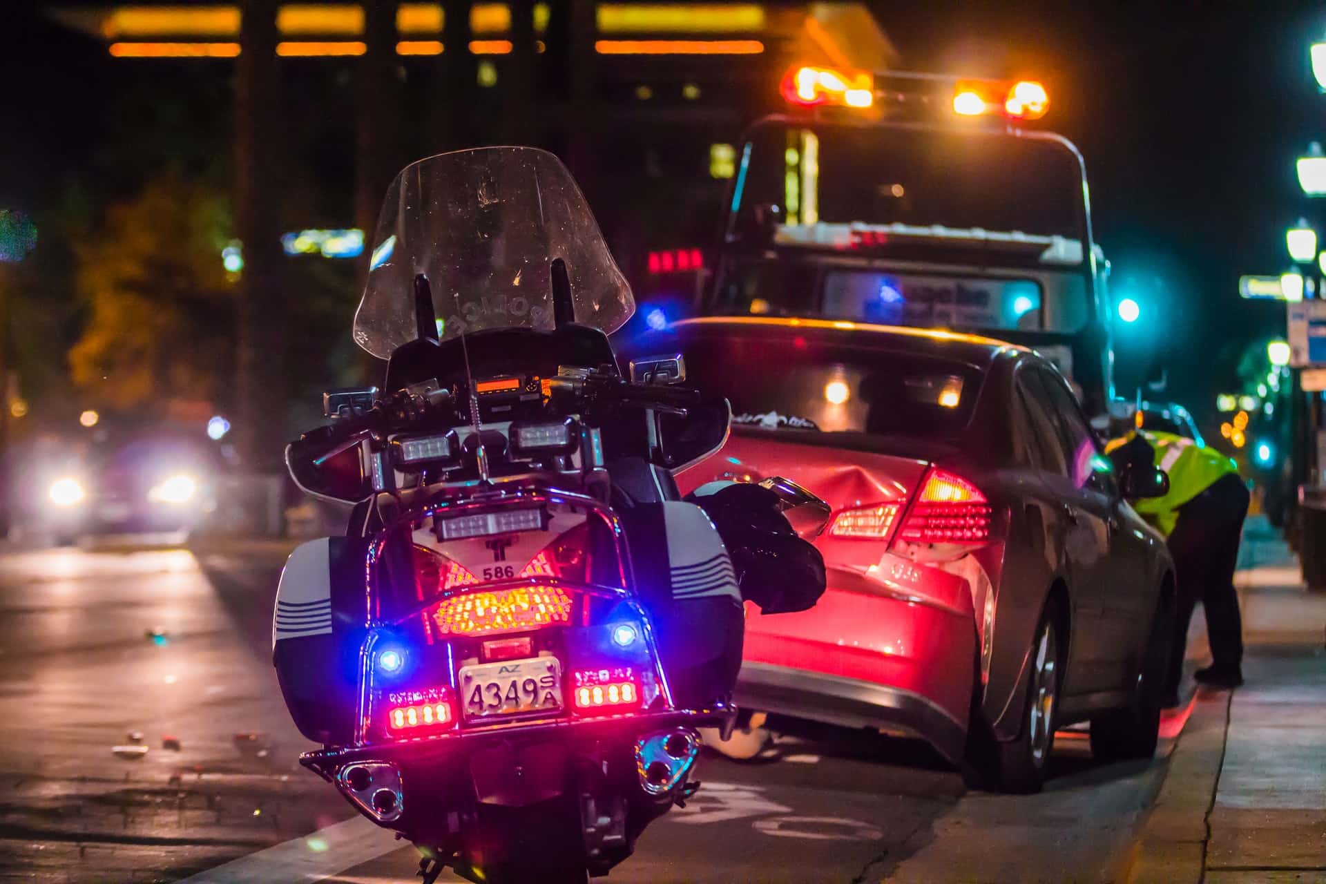 A police motorcycle at the scene of a car accident