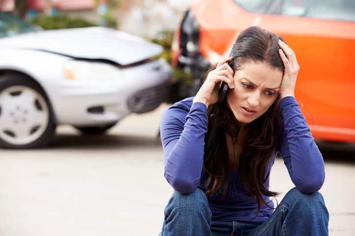 woman calling her auto insurance after getting into a lyft accident