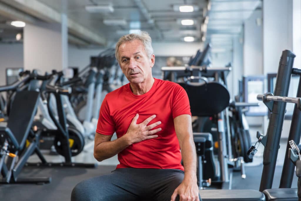 Older man have difficulty breathing at the gym