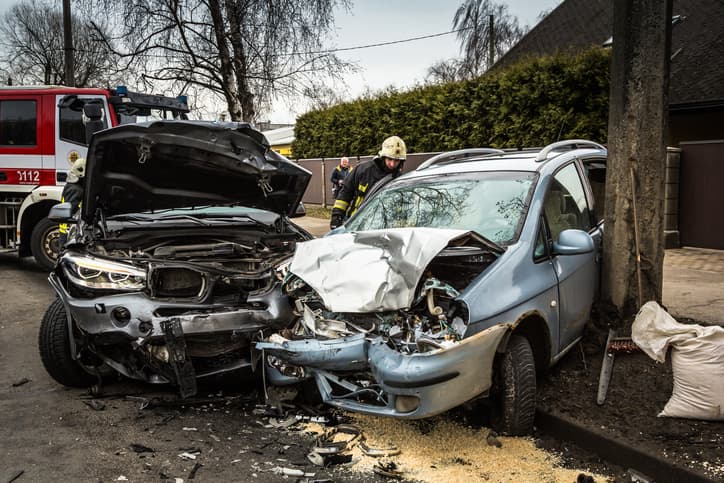 Two cars with smashed front ends after auto accident