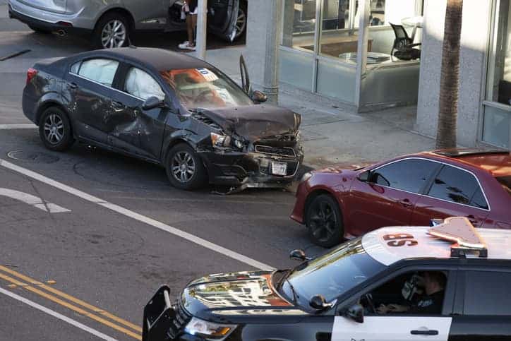 Car accident scene with two cars and police on scene