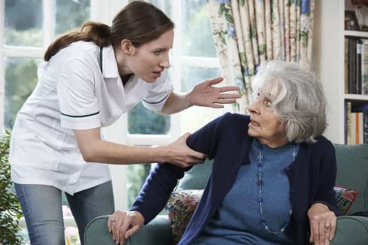 woman harassing elderly woman