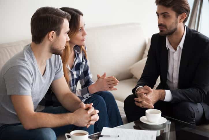 professional speaking to couple