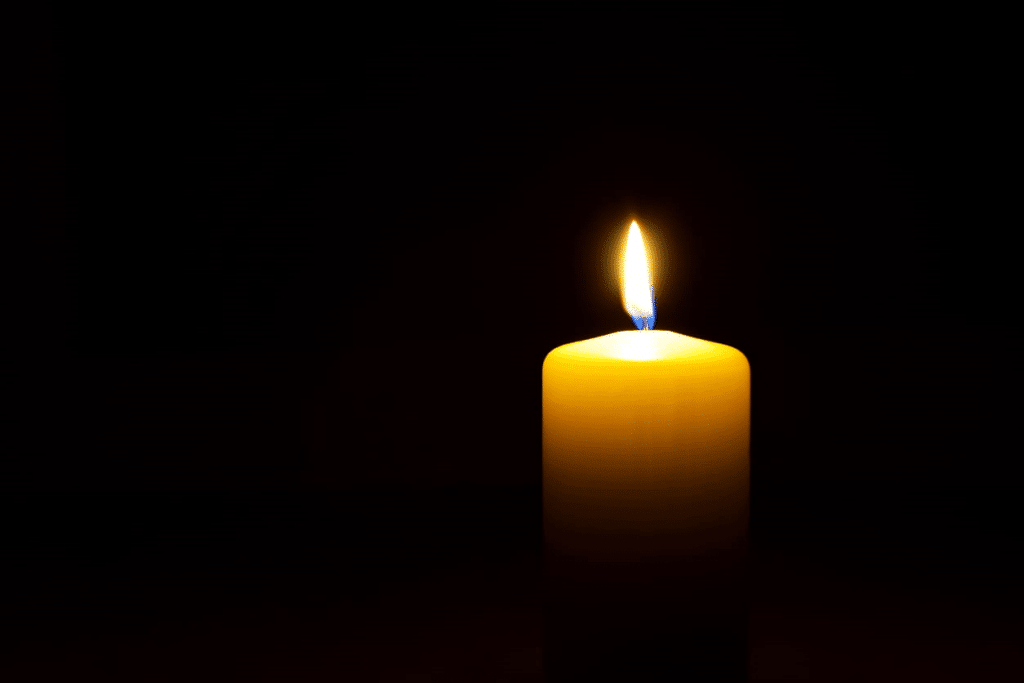A candle lit in honor of someone who died due to a wrongful death situation