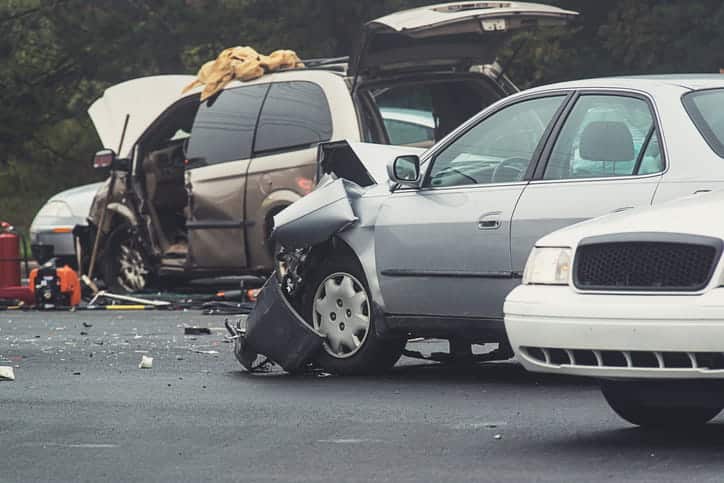 Two severely damaged vehicles after a car accident. 