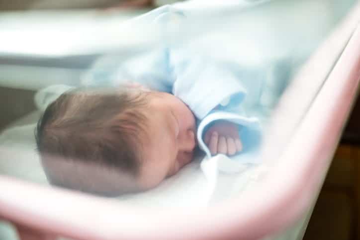 A newborn baby in the neonatal intensive care unit