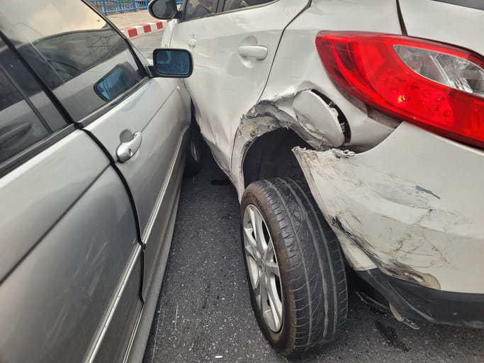 Two vehicles damaged in a collision. 