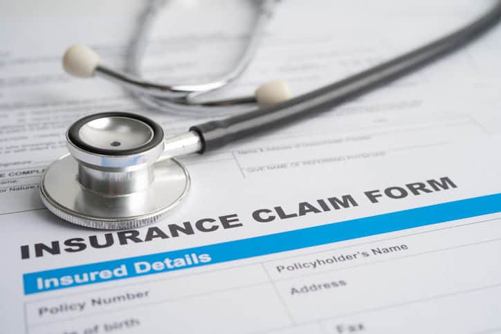 Does Medicare Cover Car Accident Injuries? 54 A Stethoscope Over An Insurance Claim Form.