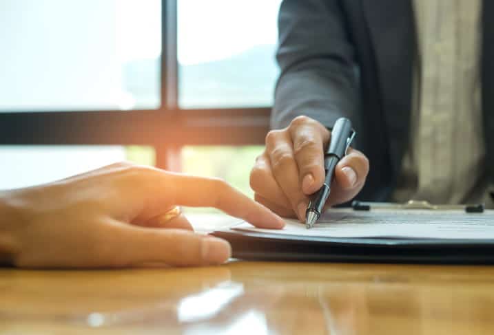 What Is A Contingency Fee? 64 A Lawyer Reviewing Their Fee Structure With A Client.