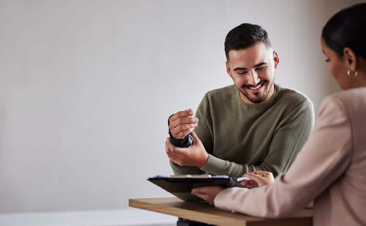 How To File A Personal Injury Claim 61 A Man In An Arm Cast Smiles As He Reviews Paperwork With His Personal Injury Lawyer.