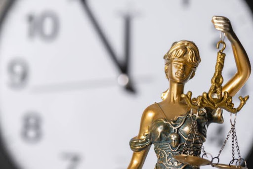 Florida Car Accident Statute Of Limitations 1 Lady Justice Stands By A Clock, Showing That Justice Should Be Fair And On Time.