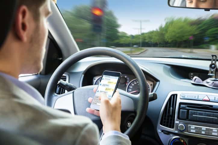 Texting And Driving Accidents 1 A Man Texting While Driving.