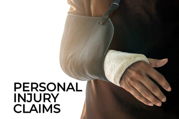 Hollywood Personal Injury Lawyer 2 A Close-Up Of A Person'S Arm In A Gray Sling And White Cast, With The Text &Quot;Personal Injury Claims&Quot; Prominently Displayed Below In Bold Black Letters.