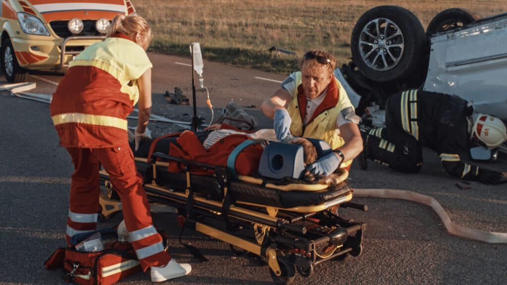 Miami Catastrophic Injury Lawyer 10 Severely injured car accident victim receiving emergency medical assistance after a catastrophic crash